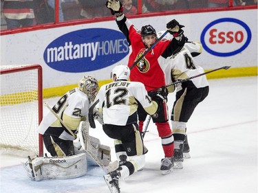Kyle Turris celebrates the winning goal in the overtime period as the Ottawa Senators take on the Pittsburgh Penguins in NHL action at Canadian Tire Centre in Ottawa. Assignment - 118582 Photo taken at 22:13 on April 7. (Wayne Cuddington / Ottawa Citizen)