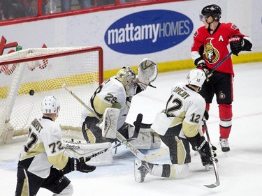 Kyle Turris looks at the winning goal in the overtime period as the Ottawa Senators take on the Pittsburgh Penguins in NHL action at Canadian Tire Centre in Ottawa. Assignment - 118582 Photo taken at 22:13 on April 7. (Wayne Cuddington / Ottawa Citizen)