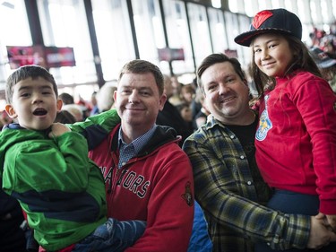 (L-R) Senators fans Ewan and Andrew Fawcett, Michael Bedard and his daughter Kiera at Canadian Tire Centre to watch the away game between Ottawa Senators vs. Philadelphia Flyers on Saturday, April 11, 2015.