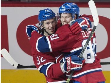 Montreal Canadiens' Lars Eller, right, celebrates his short-handed goal past Ottawa Senators goalie Andrew Hammond with teammate Brian Flynn during second period of Game 1 NHL Stanley Cup first round playoff hockey action Wednesday, April 15, 2015 in Montreal.