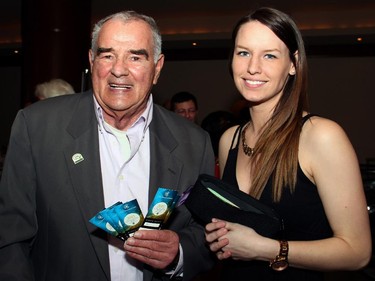 Legendary fundraiser Dave Smith, seen with volunteer Kaitlyn Nuttall, sold raffle tickets at the 27th Commonwealth Dinner held at the Brookstreet Hotel on Tuesday, April 7, 2015.