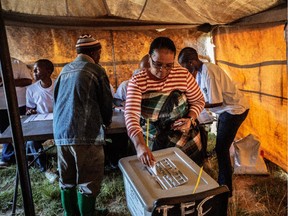 A resident casts her ballot in the Lesotho parliamentary election at a voting station on the outskirts of Maseru on Feb. 28, 2015.