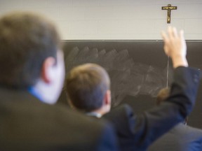 The Supreme Court of Canada ruled that Quebec infringed on the religious freedom of Loyola High School in Montreal by requiring it to teach the province's ethics and religious culture program. Students attend class at Loyola in Montreal Thursday, March 19, 2015.