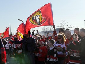 Many hundreds of excited fans get ready to greet the Ottawa Senators players as they arrive at Ottawa airport, Saturday, April 11, 2015. The team punched their ticket the playoffs with a 3-1 victory over Philadelphia on Saturday.