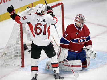 Ottawa Senators right wing Mark Stone (61) celebrates after Montreal Canadiens goalie Carey Price (31) leta in the third goal during second period of Game 5 NHL first round playoff hockey action Friday, April 24, 2015 in Montreal.