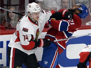 Ottawa Senators defenseman Mark Borowiecki (74) runs into Montreal Canadiens right wing Devante Smith-Pelly (21) during first period of Game 2 NHL first round playoff hockey action Friday, April 17, 2015 in Montreal.