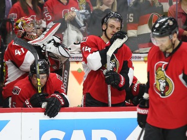 Mark Borowiecki (middle) of the Ottawa Senators and his team show their dejection after losing their series against the Montreal Canadiens during third period of NHL action at Canadian Tire Centre in Ottawa, April 26, 2015.  (Jean Levac/ Ottawa Citizen)