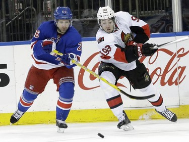 New York Rangers right wing Martin St. Louis (26) battles for the puck against Ottawa Senators center Mika Zibanejad (93) during the second period.