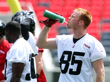 Matt Carter of the Ottawa Redblacks takes a drink during practice at TD Place.