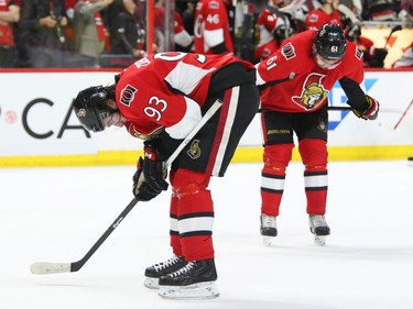 Mika Zibanejad and Mark Stone (R) of the Ottawa Senators show their dejection after losing their series against the Montreal Canadiens during third period of NHL action at Canadian Tire Centre in Ottawa, April 26, 2015.