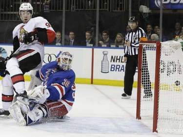 Ottawa Senators center Mika Zibanejad (93) and New York Rangers goalie Henrik Lundqvist (30) watch the puck hit the net during the first period of an NHL hockey game, Thursday, April 9, 2015, at Madison Square Garden in New York. The goal was disallowed.
