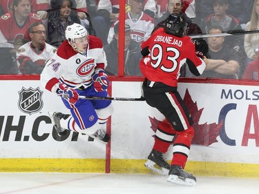 Mika Zibanejad  of the Ottawa Senators hits Alexei Emelin of the Montreal Canadiens during first period action at Canadian Tire Centre in Ottawa, April 19, 2015.