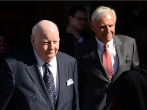 Suspended senator Mike Duffy (left) and his lawyer, Donald Bayne.