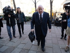 Suspended senator Mike Duffy arrives at the courthouse.