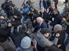 Suspended senator Mike Duffy is surrounded by the media who were once his colleagues.