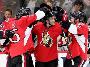 Mike Hoffman is congratulated on his goal in the third period.