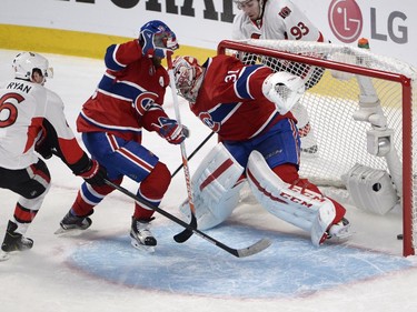 Montreal Canadiens' Andrei Markov (79) scores an own goal on Carey Price as Ottawa Senators' Bobby Ryan (6) and Mika Zibanejad (93) look on during first period NHL playoff action in Montreal, Wednesday, April 15, 2015.