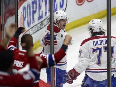 Montreal Canadiens' Brendan Gallagher (11) celebrates his goal against the Ottawa Senators with teammate Tom Gilbert (77) during first period NHL playoff action in Ottawa, Sunday, April 26, 2015.