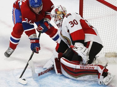 Montreal Canadiens' Brian Flynn, left, beats Ottawa Senators' goalie, Andrew Hammond, during the second period of NHL playoff action at the Bell Centre in Montreal Wednesday April 15, 2015.