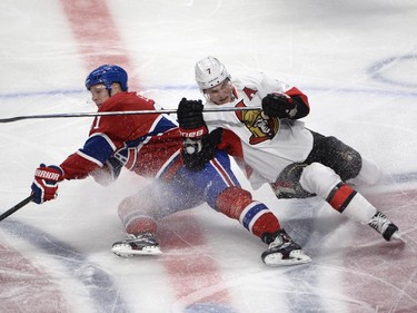 Montreal Canadiens' Lars Eller (81) and Ottawa Senators' Kyle Turris (7) battle for the puck at centre ice during first period NHL playoff action in Montreal, Wednesday, April 15, 2015.