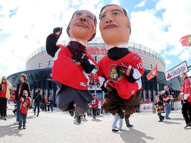 The Prime Minister mascots enjoy the atmosphere prior to the start of a game between the Ottawa Senators and the Montreal Canadiens in Game Six of the Eastern Conference Quarterfinals during the 2015 NHL Stanley Cup Playoffs at Canadian Tire Centre on April 26, 2015 in Ottawa, Ontario, Canada.
