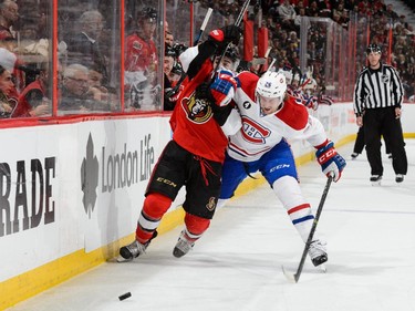 Jean-Gabriel Pageau #44 of the Ottawa Senators and Jeff Petry #26 of the Montreal Canadiens battle for the puck in Game Six of the Eastern Conference Quarterfinals during the 2015 NHL Stanley Cup Playoffs at Canadian Tire Centre on April 26, 2015 in Ottawa, Ontario, Canada.