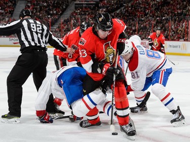 Mika Zibanejad #93 of the Ottawa Senators collects the puck after the draw in Game Six of the Eastern Conference Quarterfinals against the Montreal Canadiens during the 2015 NHL Stanley Cup Playoffs at Canadian Tire Centre on April 26, 2015 in Ottawa, Ontario, Canada.