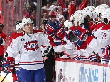 Brendan Gallagher #11 of the Montreal Canadiens celebrates his first period goal against the Ottawa Senators with team mates on the bench in Game Six of the Eastern Conference Quarterfinals during the 2015 NHL Stanley Cup Playoffs at Canadian Tire Centre on April 26, 2015 in Ottawa, Ontario, Canada.