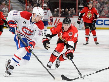 Lars Eller #81 of the Montreal Canadiens tries to move the puck past Kyle Turris #7 of the Ottawa Senators in Game Six of the Eastern Conference Quarterfinals during the 2015 NHL Stanley Cup Playoffs at Canadian Tire Centre on April 26, 2015 in Ottawa, Ontario, Canada.