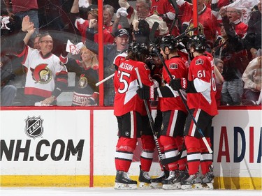 Clarke MacArthur #16 of the Ottawa Senators celebrates his first period goal against the Montreal Canadiens with team mates Erik Karlsson #65, Marc Methot #3 and Mark Stone #61 in Game Three of the Eastern Conference Quarterfinals during the 2015 NHL Stanley Cup Playoffs at Canadian Tire Centre on April 19, 2015 in Ottawa, Ontario, Canada.