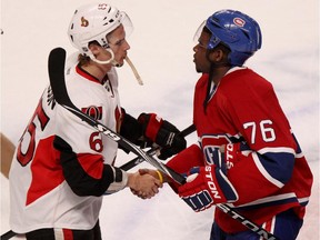 P.K. Subban, right, shakes hands with Erik Karlsson following the Senators playoff series victory  in Montreal Thursday May 9, 2013.
