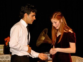 Nicholas Fassbender (L)  as Jim O'Connor and Brynn Rhude (R) as  Laura Wingfield, in a scene from  All Saints Catholic High School's Cappies production of the Glass Menagerie.