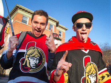 Nicholas Lowe (L), and Ian Medaglia are pumped for the playoffs as they chant Go Sens Go with their buddies on  the Sensmile on Elgin Street to watch the Ottawa Senators take on the Montreal Canadiens on television in game 1 of the playoffs.