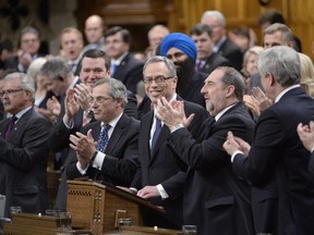 Finance Minister Joe Oliver receives applause before tabling the federal budget in the House of Commons in Ottawa on Tuesday, April 21, 2015.