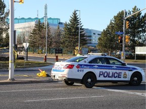 Ottawa Police cordoned off a portion of Ogilvie Road at the entrance to CSEC and CSIS after a woman was struck by an SUV.