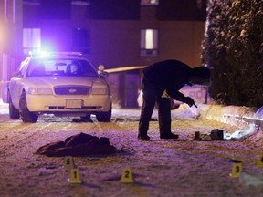 Ottawa police investigate a shooting where one man was injured on Lats Private off Doane Ave in west end Ottawa, Saturday, January 10, 2015. Mike Carroccetto / Ottawa Citizen