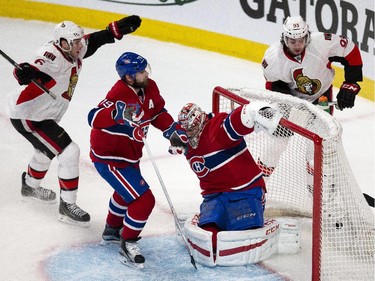 Ottawa Senators' Bobby Ryan, left, and Mika Zibanejad, far right, celebrate a goal agains Montreal Canadiens' goalie, Carey Price while Andrei Markov, 79, looks on during the first period of NHL playoff action at the Bell Centre in Montreal Wednesday April 15, 2015.