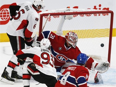 Ottawa Senators' Bobby Ryan, left, looks on as Mika Zibanejad, 93, beats Montreal Canadiens' goalie, Carey Price, while Brandon Prust, 8, looks on during the second period of NHL playoff action at the Bell Centre in Montreal Wednesday April 15, 2015. (Darren Brown/Ottawa Citizen)