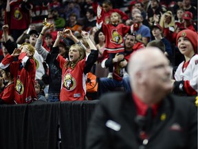 Ottawa Senators fans cheer at Canadian Tire Centre as the team scores a goal during the away game between Ottawa Senators vs. Philadelphia Flyers on Saturday, April 11, 2015.