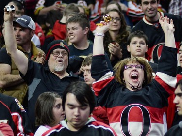 Ottawa Senators fans cheer at Canadian Tire Centre as the team scores a goal during the away game between Ottawa Senators vs. Philadelphia Flyers on Saturday, April 11, 2015.