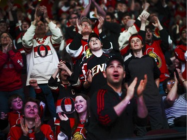 Ottawa Senators fans cheer at Canadian Tire Centre as the team scores a goal during the away game between Ottawa Senators vs. Philadelphia Flyers on Saturday, April 11, 2015.