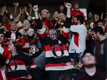 Ottawa Senators fans cheers at Canadian Tire Centre as the team scores a goal during the away game between Ottawa Senators vs. Philadelphia Flyers on Saturday, April 11, 2015. (James Park / Ottawa Citizen)