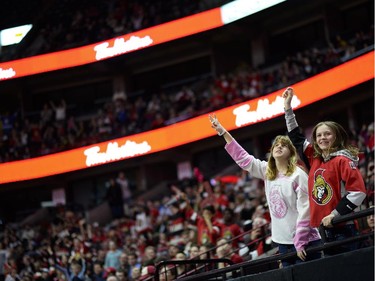 Ottawa Senators fans cheer at Canadian Tire Centre as the team scores a goal during the away game between Ottawa Senators vs. Philadelphia Flyers on Saturday, April 11, 2015.