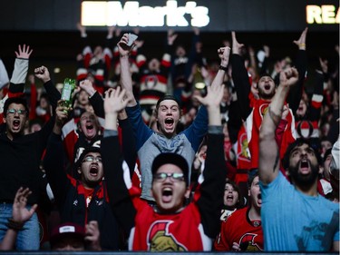 Ottawa Senators fans cheer at the Canadian Tire Centre as the team scores a goal in Philadelphia on Saturday, April 11, 2015.