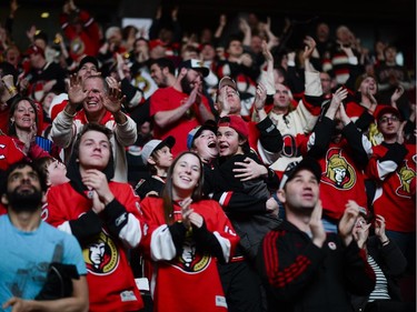 Ottawa Senators fans cheer at Canadian Tire Centre as the team scores a goal during the away game between Ottawa Senators vs. Philadelphia Flyers on Saturday, April 11, 2015.