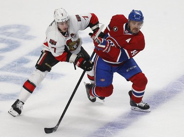 Ottawa Senators' Kyle Turris, 7, and Montreal Canadiens' Tomas Plekanec, 14, battle during the first period of game two during round one o the 2015 NHL Playoffs at the Bell Centre in Montreal Friday April 17, 2015.