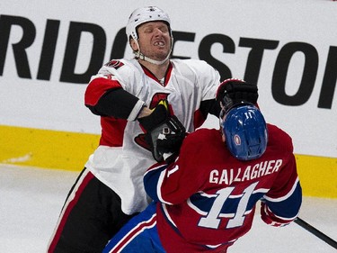 Ottawa Senators' Marc Methot, left, lays a hit on Montreal Canadiens' Brendan Gallagher during the first period Game 1 on Wednesday.