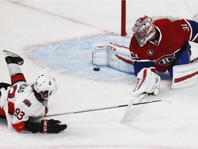 The Ottawa Senators' Mike Zibanejad watches as Montreal Canadiens goalie Carey Price makes a toe save during the first period of Game 2.