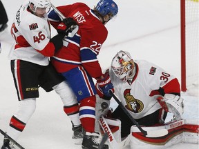 Ottawa Senators' Patrick Wiercioch, 46, defends Montreal Canadiens' Dale Wiesse, 22, as he crashes the net on Sens goalie, Andrew Hammond, during the second period of Game 2 tonight.