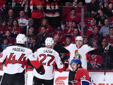 Patrick Wiercioch #46 of the Ottawa Senators celebrates his first period goal with teammates during Game Five of the Eastern Conference Quarterfinals of the 2015 NHL Stanley Cup Playoffs at the Bell Centre on April 24, 2015 in Montreal, Quebec, Canada.